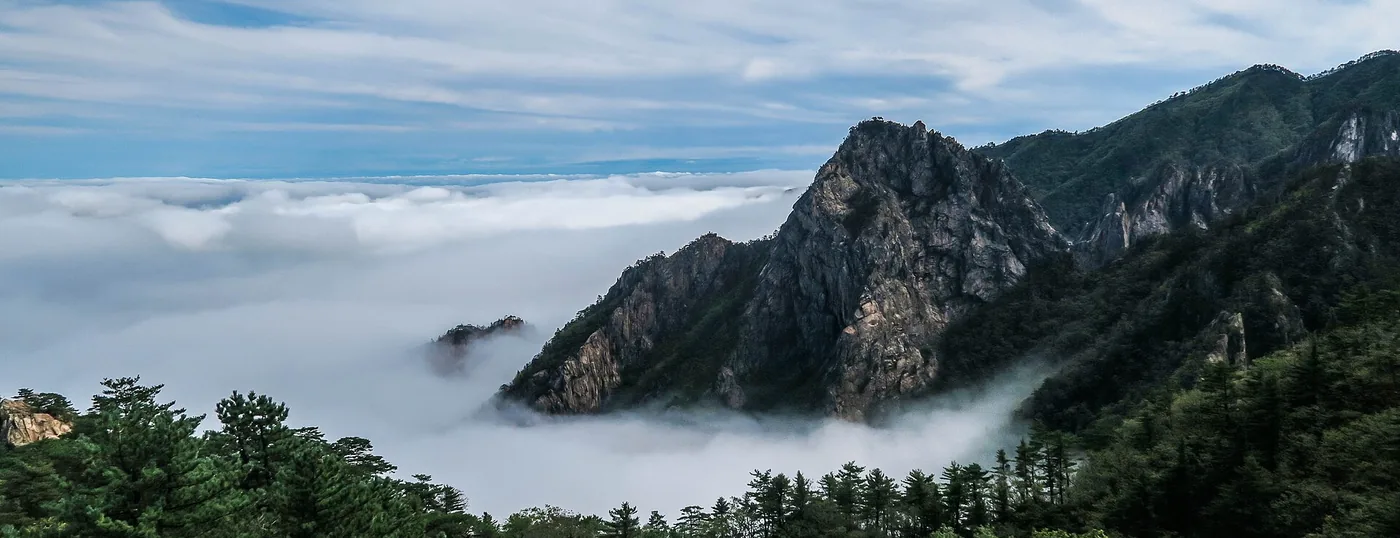 Rock ridge of Seoraksan rising above a sea of cloud at dawn