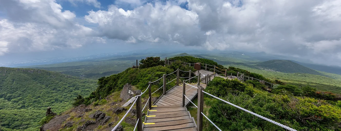 Wooden boardwalk stairway on the Yeongsil Trail, Hallasan National Park, Jeju