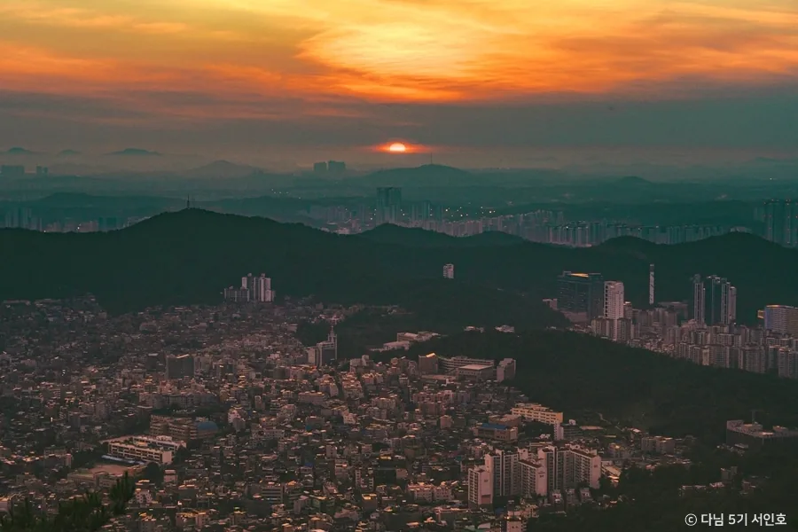 Sunset over the Seoul suburbs seen from a ridge on Bukhansan