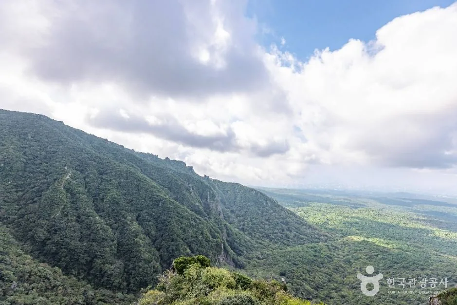 Steep forested slope on the Yeongsil side of Hallasan with Jeju's lowlands beyond